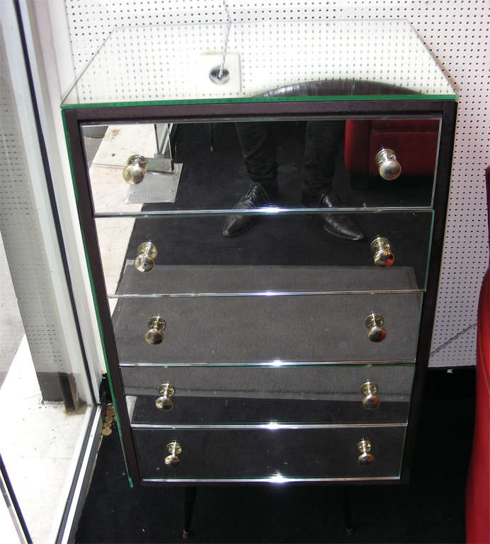 Two 1960s mirror commodes with black wood elements. Five drawers.