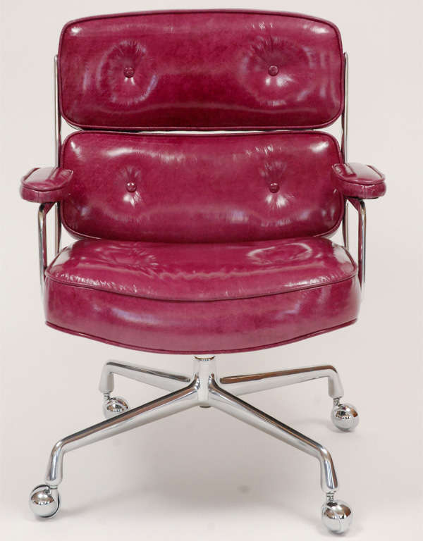 Classic office chair, from the Time Life building in New York. Designed by Charles and Ray Eames. Newly upholstered in purple patent leather with perfectly polished aluminum base and new chrome casters. Only one available in this unique purple