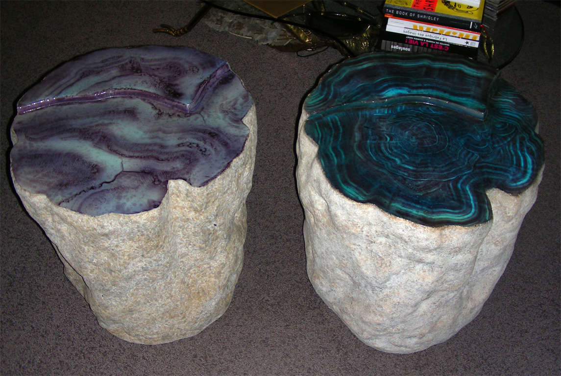A pair of rare and unusual sculptural side Tables made as faux petrified wood tables  in fiberglass ,the details  of the carved sides  and the paint work makes these  two artwork objects of the pop art era.