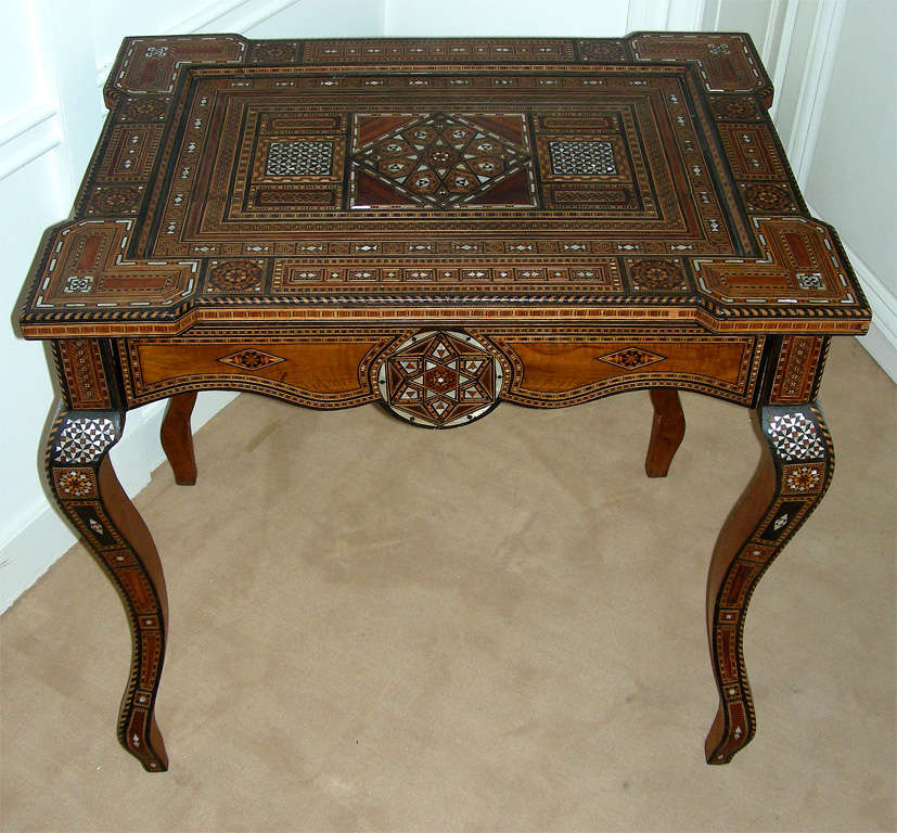 a SYRIAN CENTRE  TABLE/DESK  WITH CABRIOLET LEGS, INLAID WITH MARQUETRIES IN DIFFERENT MATERIALS  AND VARIOUS PRECIOUS WOOD
please ask for more details of the materials 