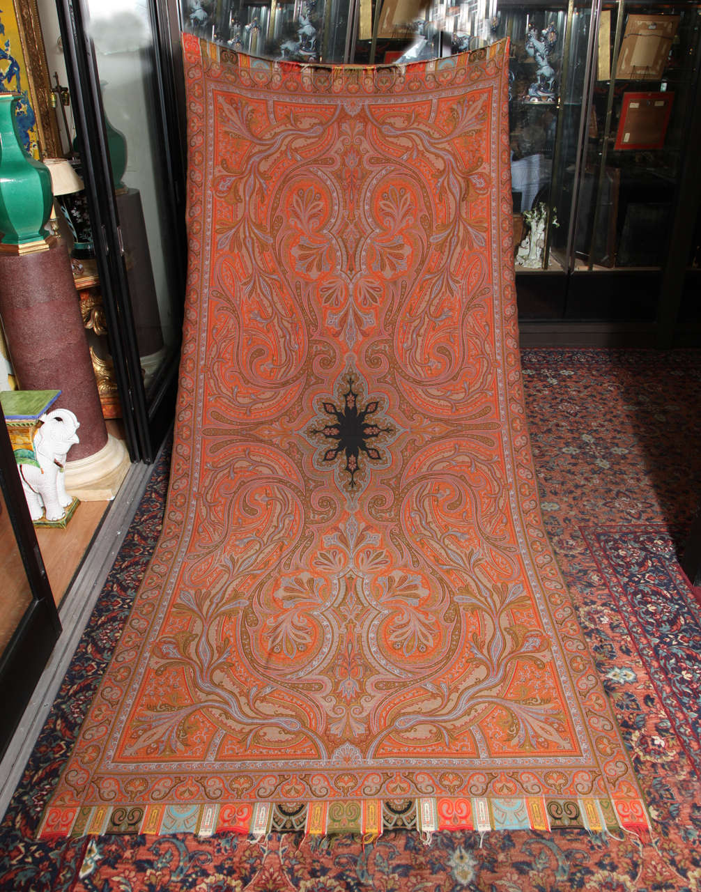 19th century wool shawl of traditional design{the boteh or paisley shape} surrounding a central medallion and  with multiple borders . The original jewel tone colors are intact , unfaded by age. Always considered a luxury item these shawls have been