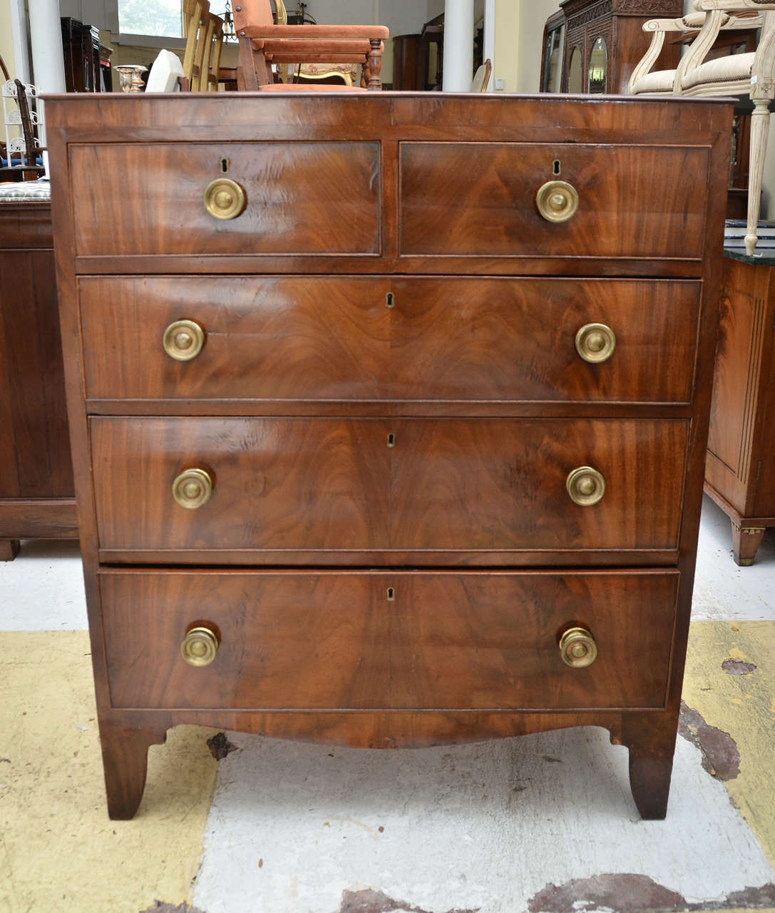 Early 19 Th C. American Narrow Chest of Drawers With Beautifully Patinated Flame Mahogany Veneered Front & Solid Mahogany Sides & Top. Original Round Brass Pulls. Base with Bracket Feet Centered by A Swaged Apron. Back With Penciled Inscription Mary