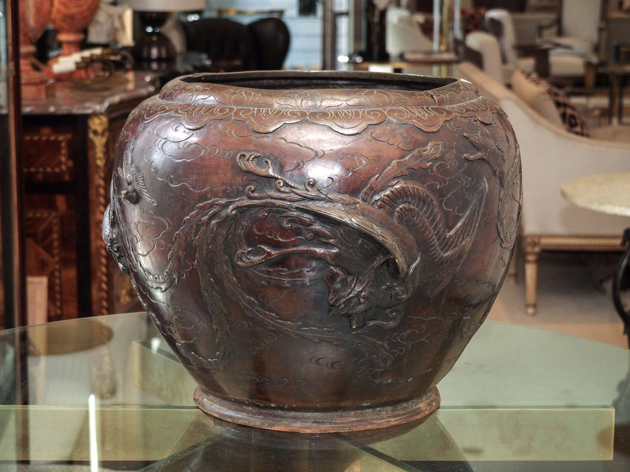 Attractive large cast bronze jardinière, probably Asian in origin, adorned with birds careening amongst the clouds