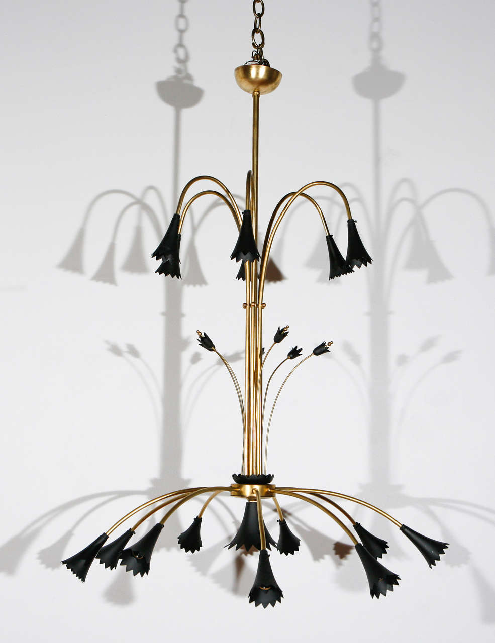 21 light fixture with candelabra sockets; black flowers have been repainted