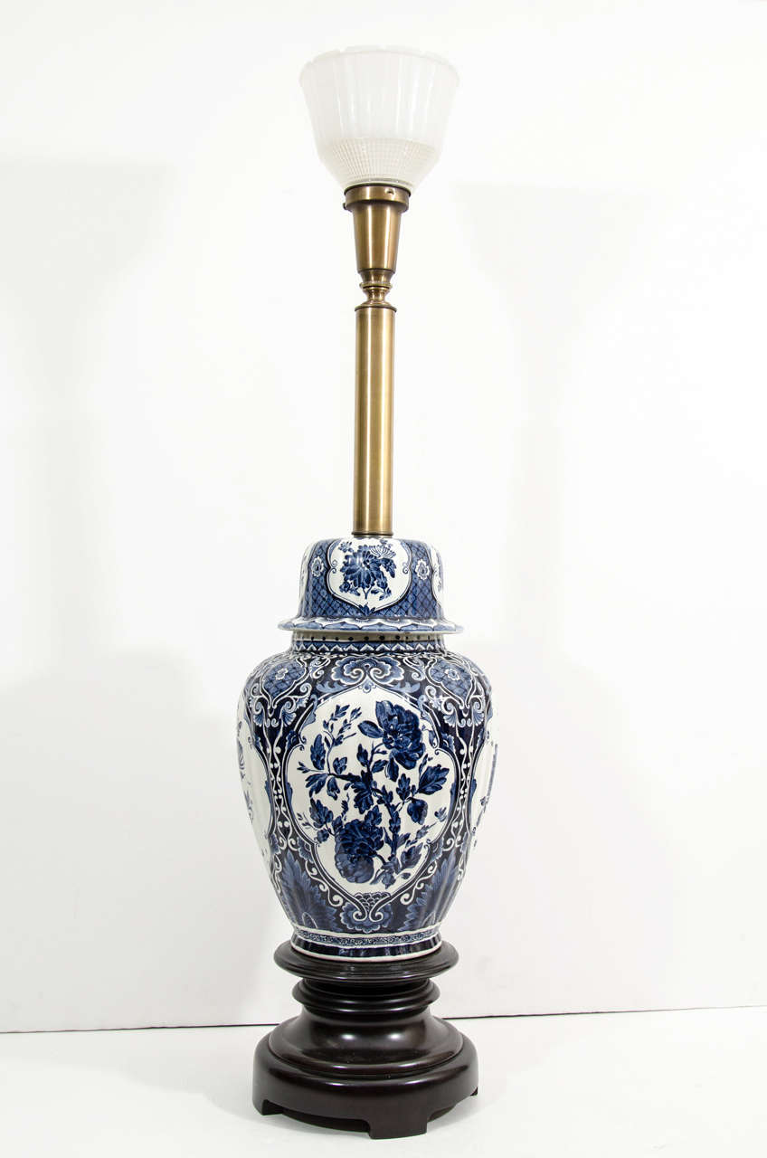 Stunning pair of blue and white Asian inspired ceramic ginger jar table Lamps with floral decoration, frosted glass shades to hold lamp shades on a wooden Pedestal Base.I have the Original Tall Elaborate Shades that are custom made to these Lamps