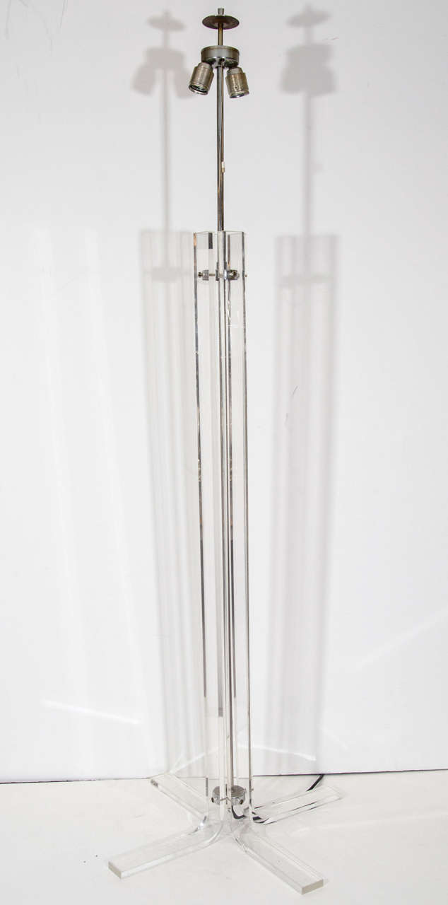 A vintage Italian floor lamp with four Lucite beams around a central chrome rod. European wiring and socket. Retrofited for use in the US