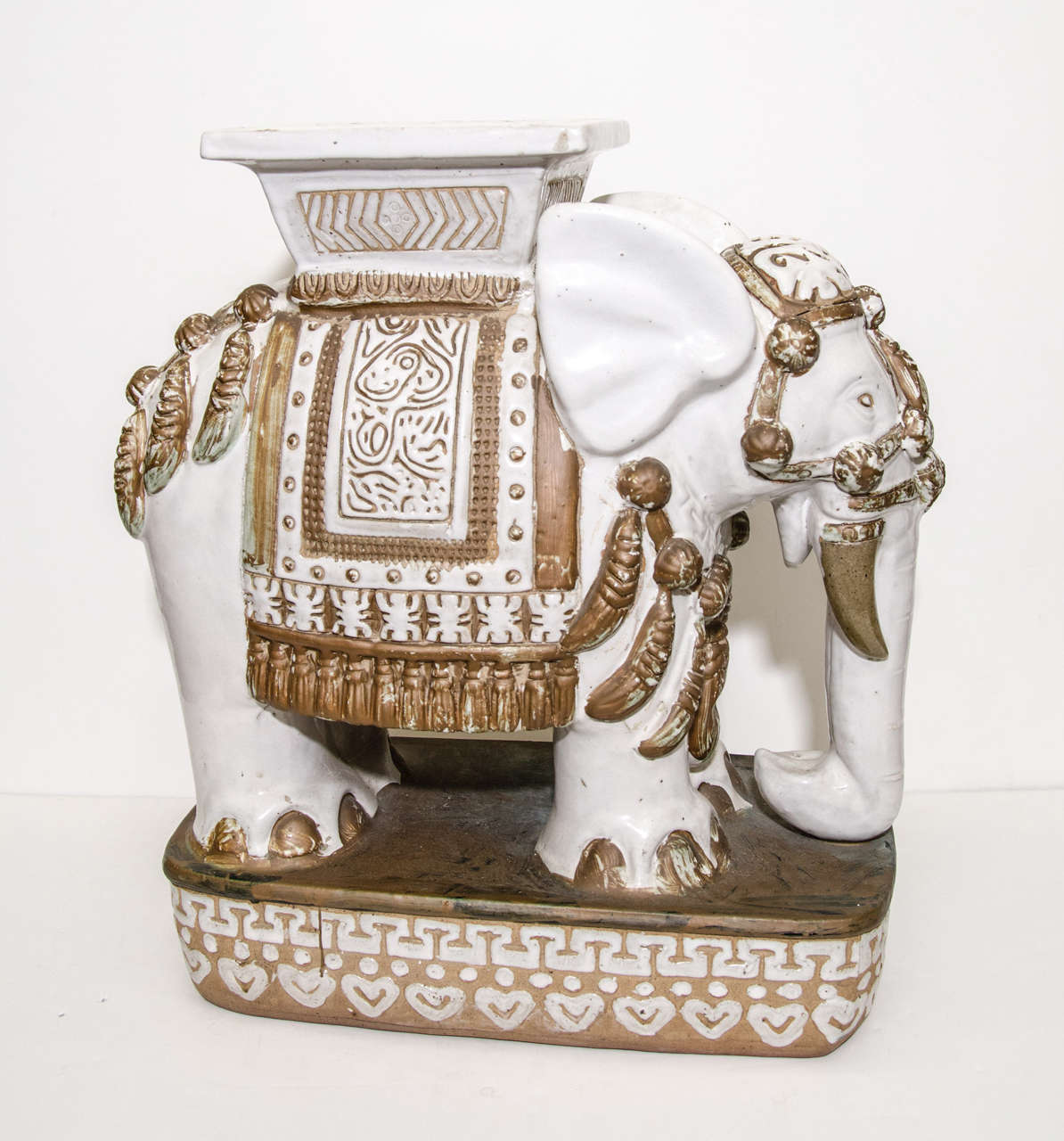 A vintage pair of highly decorative ceramic elephant stools or tables with painted gold detail. There is some wear to the gold paint.

Reduced from:  $2,450