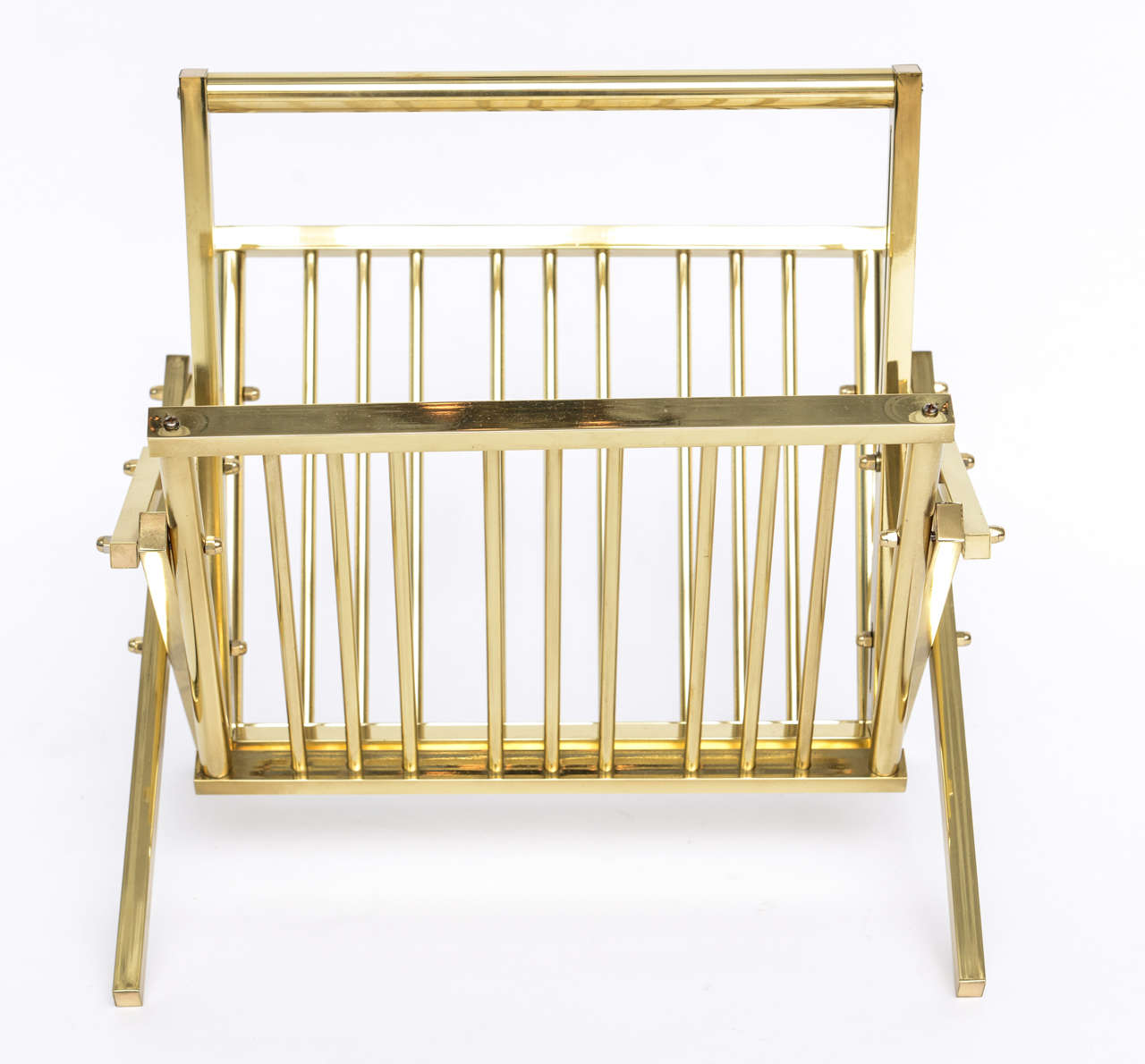Solid, substantial, and stylish 70's Italian-made magazine rack in polished solid brass folds flat.