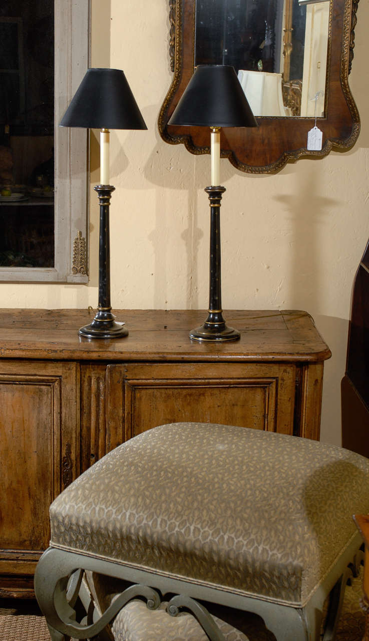 Pair of Black and Gilt Candlestick Lamps