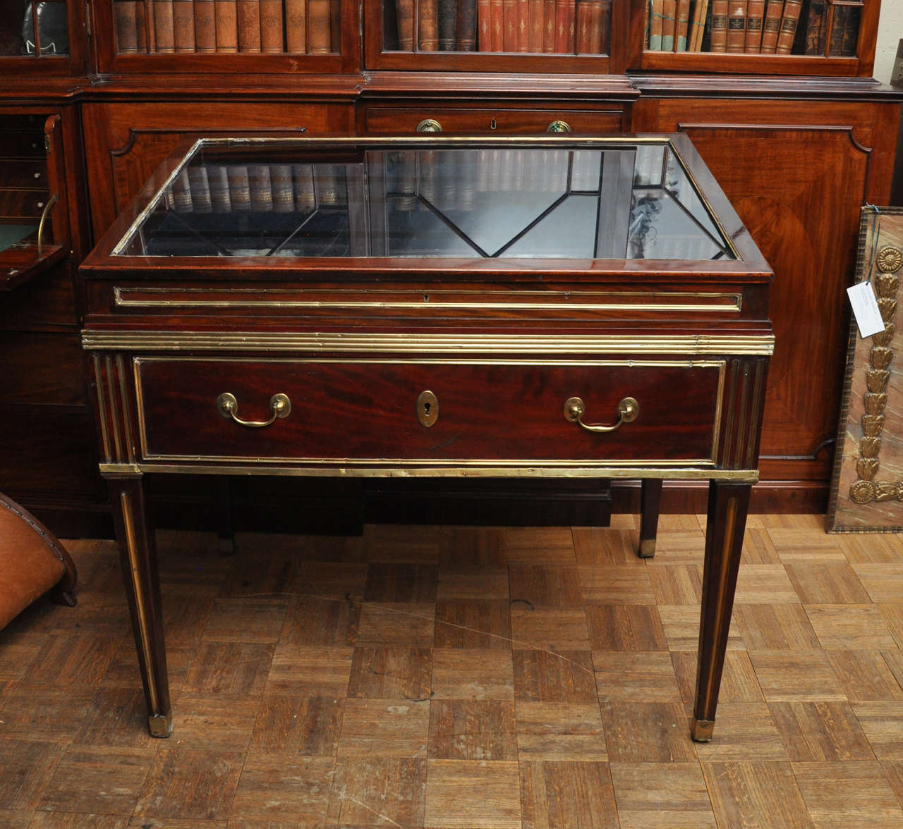 Russian Neo-Classical Style Gilt-Brass and Mahogany Vitrine / Display Case, Circa 1830, in the Louis XVI taste, with Glass Cover and large drawer with keys. Free-standing. Ideal for a serious collector and/or library. Height at front: 35.75 in.