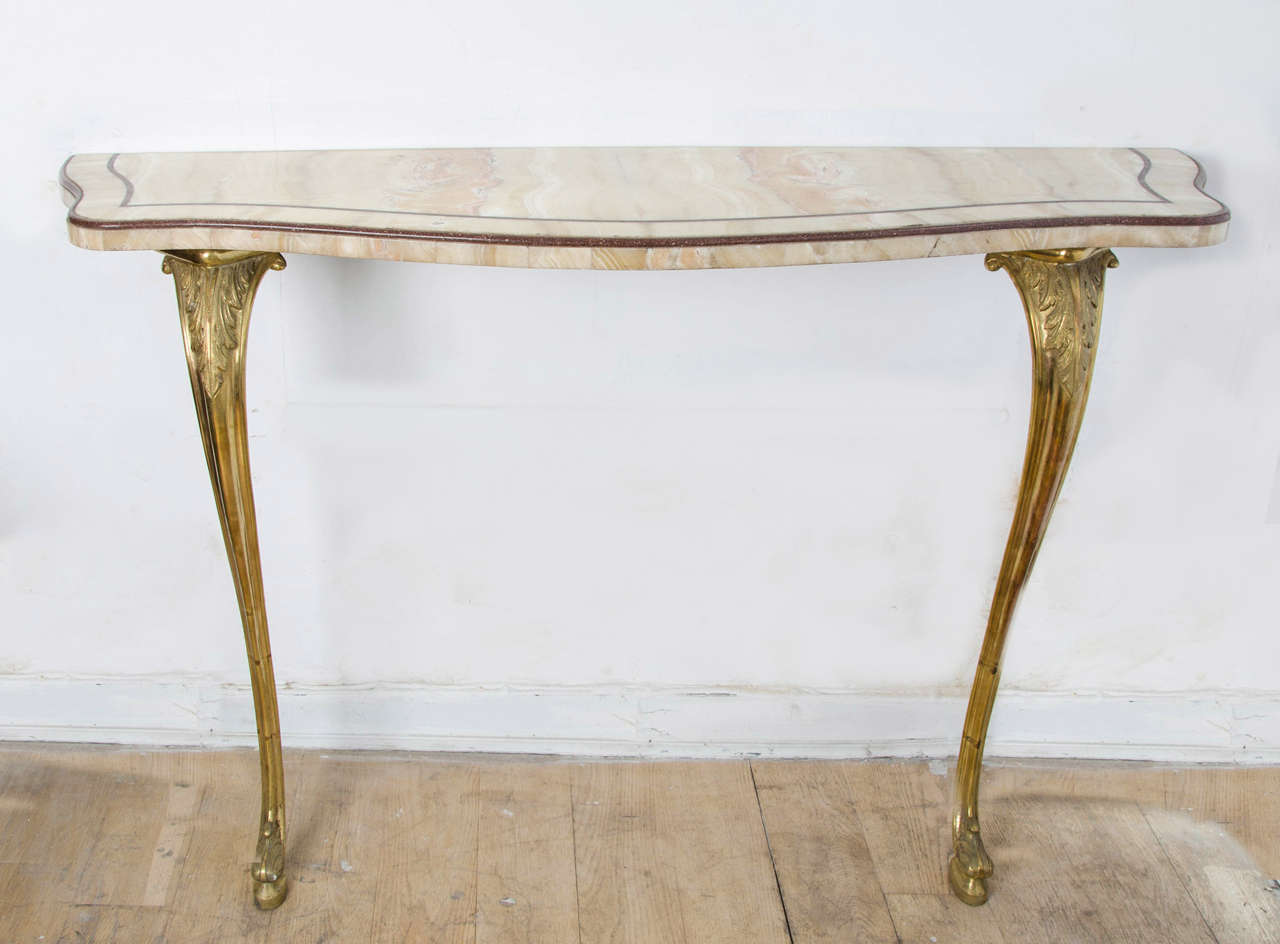 1920s Italian gilded bronze console and marble top, with “Porphyry” edges.