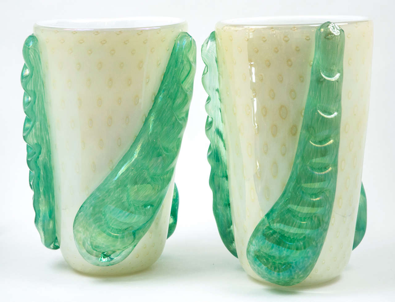 Pair of large Murano blown crème vases with a unique mint green color leaves applied asymmetrically signed Cenedese.