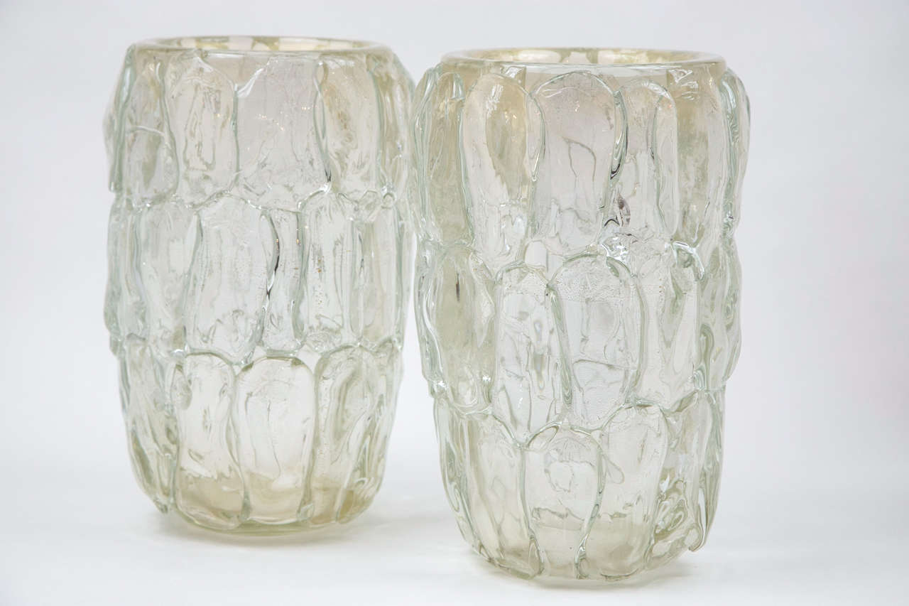 A cool and unique pair of heavily laden icy gold blown petal shapes from each of these two vases, signed Cenedese, Murano, 1970s.
(40 lbs a piece!).