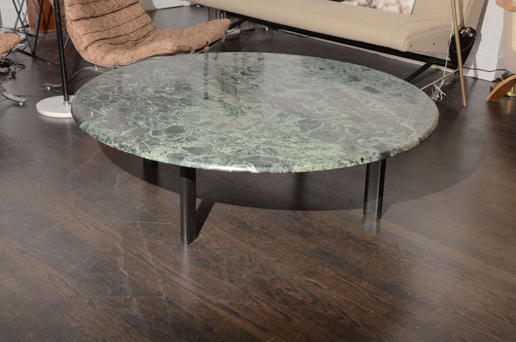 This large round table is in green marble and seems to float on its four inset black legs. Table designed by Joe D'urso for the Knoll Studio it is labeled and all original.

 