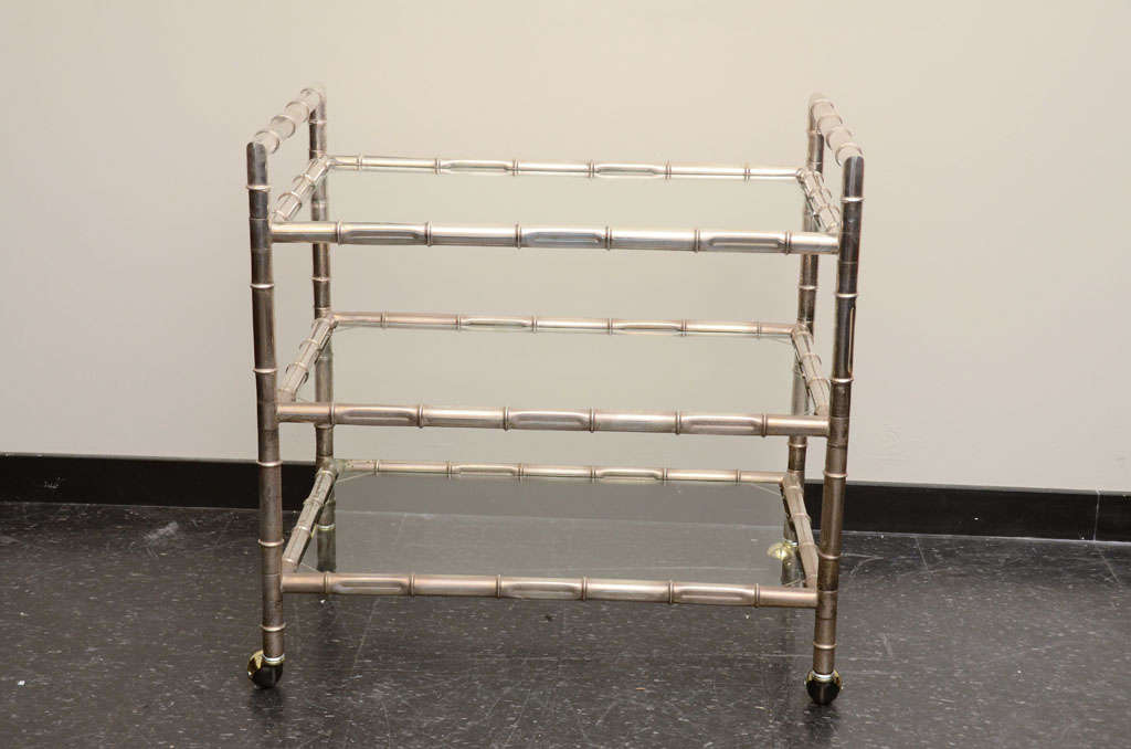 Glamorous 1970's nickel plated faux bamboo bar cart  with glass shelves