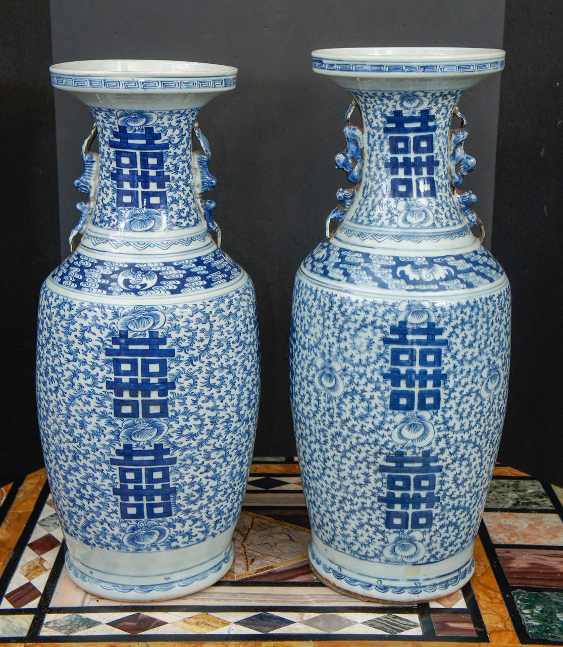 This large pair of vases with double happiness symbols was made in China in the very late 19th century or possibly within the first decade of the republic period. Made as export wares to be sent abroad the color of the blue is deep and rich. While