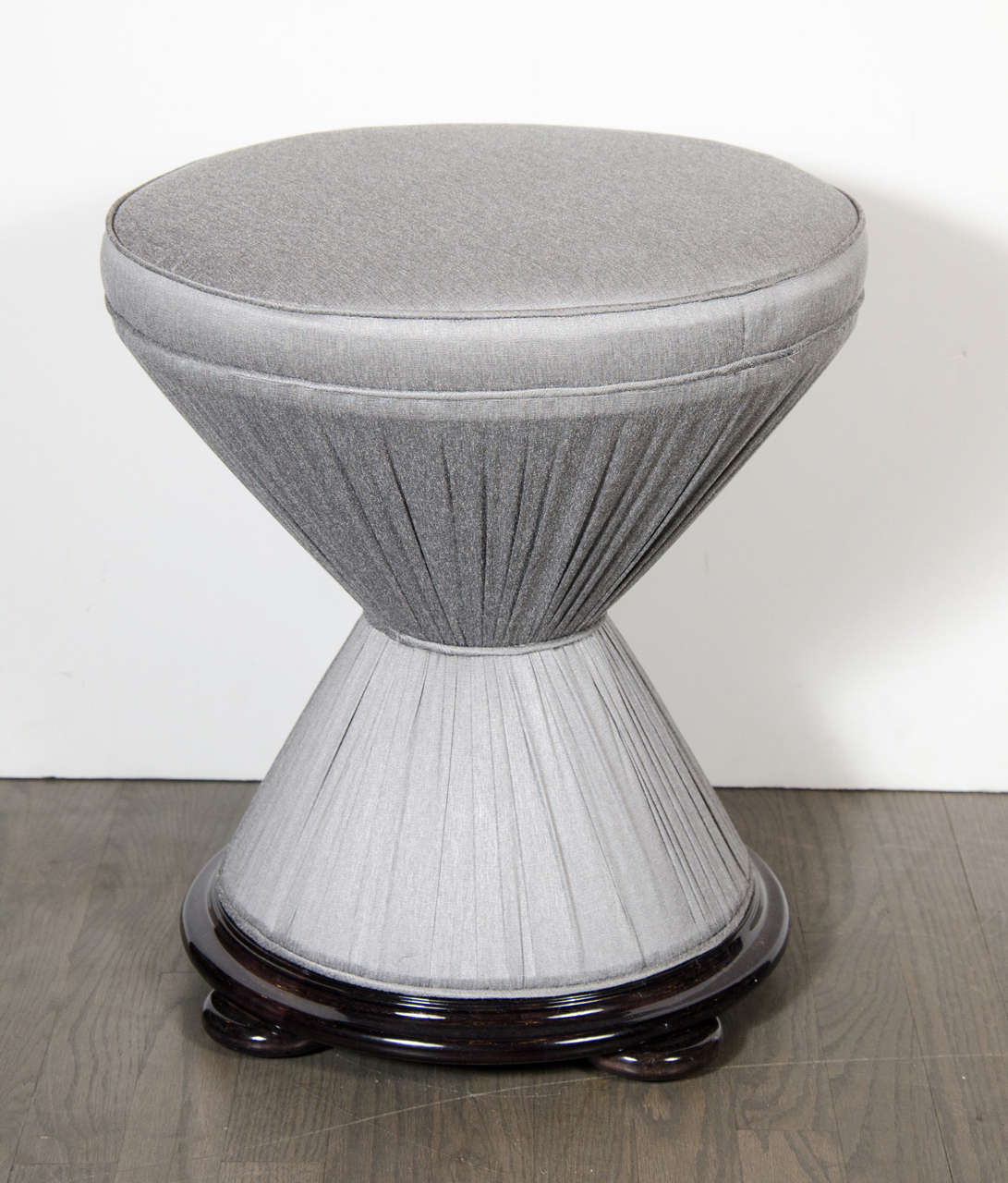 This exquisite stool has been newly upholstered in a sharkskin platinum upholstery with a stepped base of ebonized walnut. This stool has been mint restored.