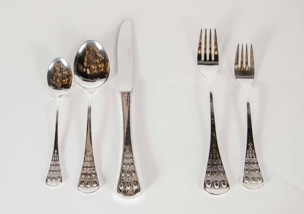 This stunning set of 12 is extremely rare and long out of production. It was designed by Bjorn Wiinblad for Rosenthal and has a nice heavy weight to these pieces. It has 12 dinner knives, 12 dinner forks 12 salad forks, 12 soup spoons and 12
