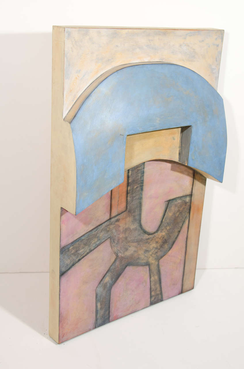 Outstanding abstract painting consisting of acrylic paint over hand-carved wood panel with three-dimensional forms. The artwork has a rectangular form with carved and cut-out center arches and features a central figural form. Created in hues of pale