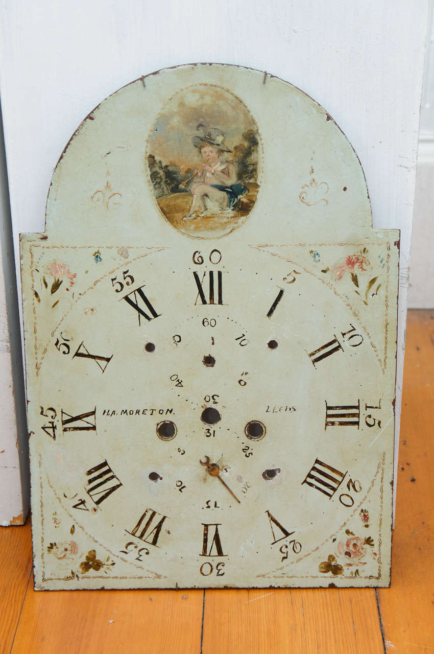 Three English painted metal break-arch clock faces, one with rotating phases-
of-the-moon dial, the others marked 