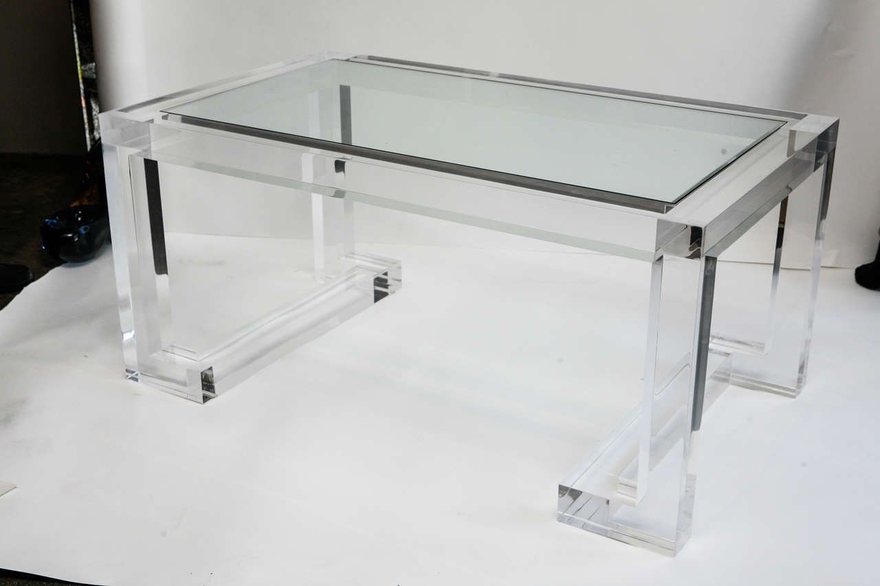 Chunky Legs and Frame Support an Inset Glass Top