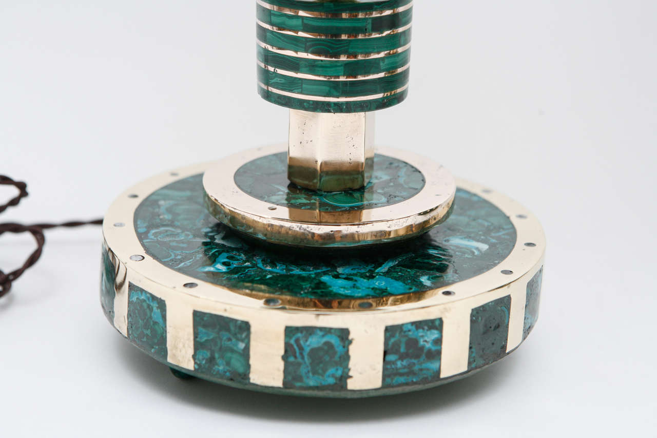 This chic lamp in the style of Pepe Mendoza has a body composed of stacked malachite and polished brass discs decreasing in size from base to neck. Slight imperfections in this handmade fixture only adds to its charm.
Newly rewired with brown silk