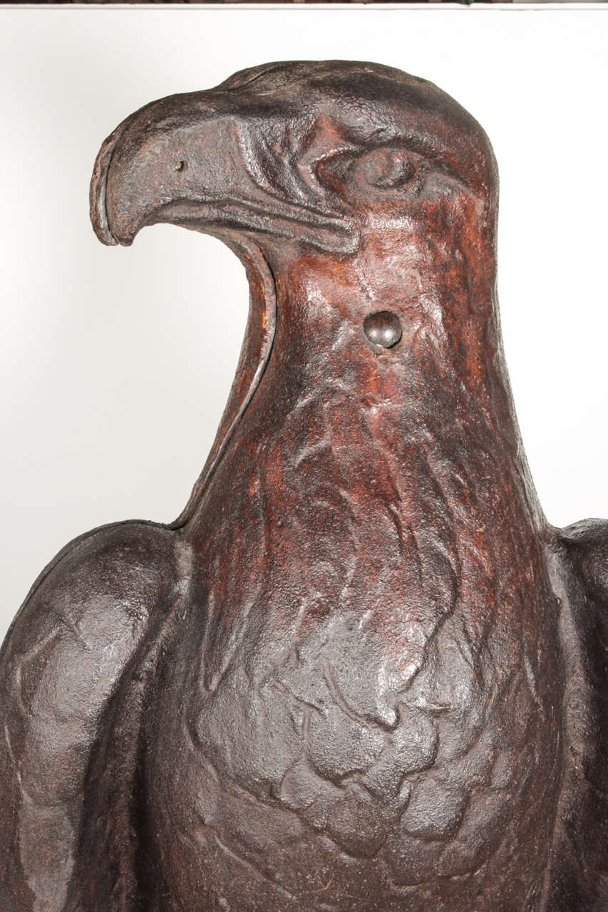 American, early 20th century cast iron eagle resting upon a
globe marked “CASE”. Case was the leading American tractor manufacturer based out of Racine, Wisconsin. This is a truly emblematic piece of Americana. Their eagle trademark “Old Abe” was