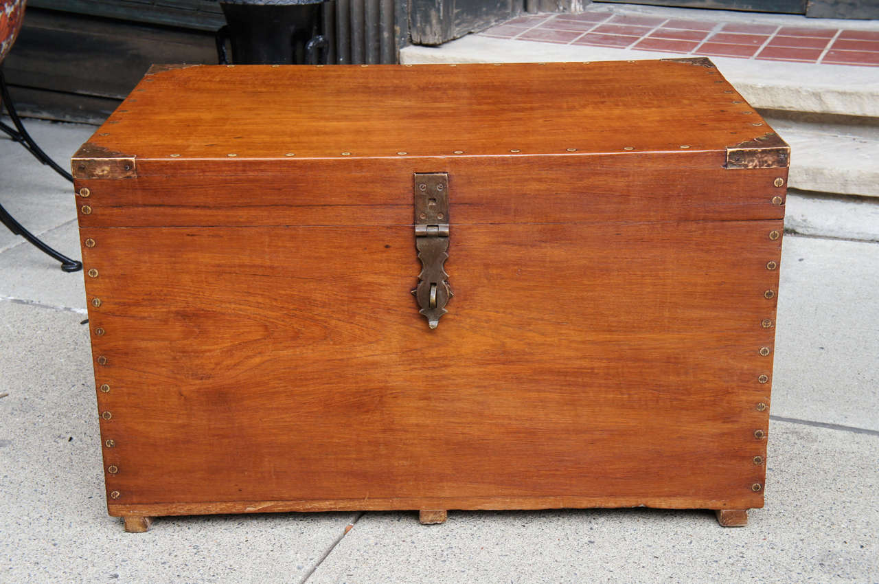 This trunk constructed of aromatic Camphor wood is a good example of the kind of work done in the last days of England great empire. Made around 1900 to 1920 this piece has English stamped locks  imported to India for a thriving market in goods made