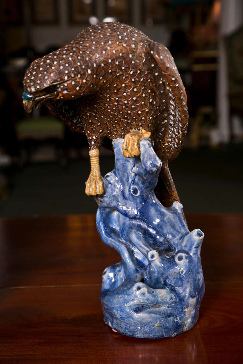A pair of Chinese pottery figures of hawks in Chien Lung style.