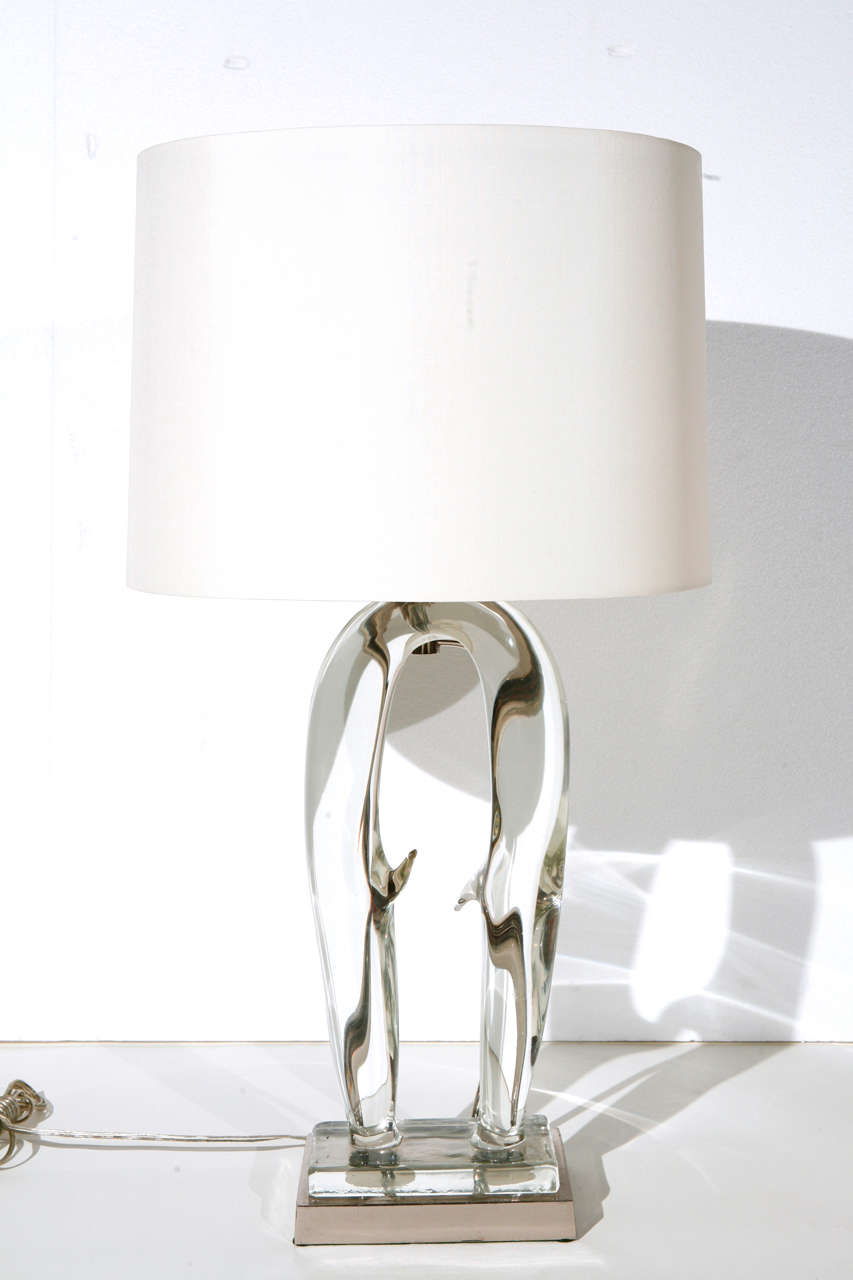 A sculptural clear Murano glass lamp.