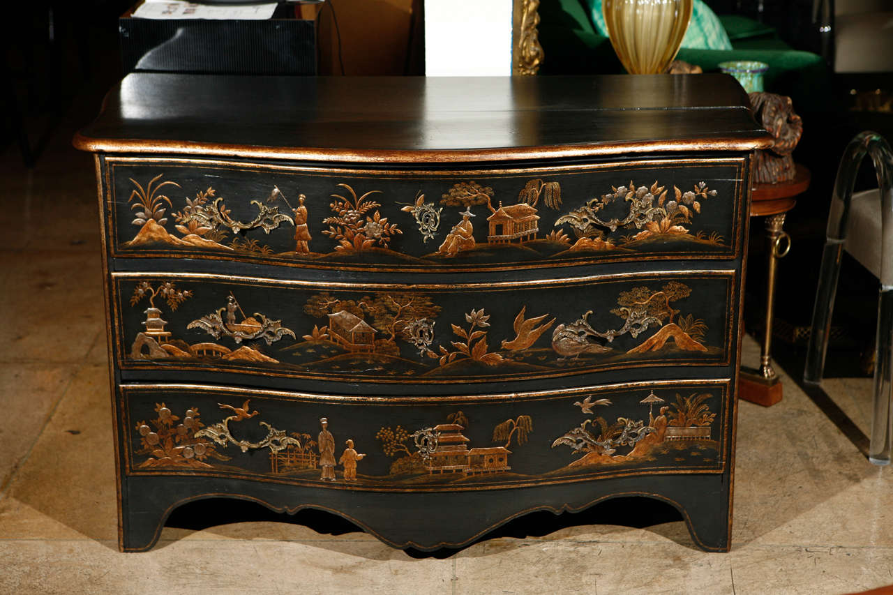 A fantastic 18th century French Louis XV chinoiserie commode. Newly restored. Amazing raised Chinese vignettes decorate the front and sides of the piece. There are three drawers with original bronze pulls. Keys are not included.