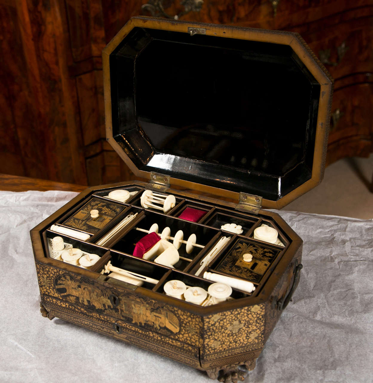 A Mid 19th Century Chinese Lacquered Sewing Box with a Drawer and Ivory fittings.