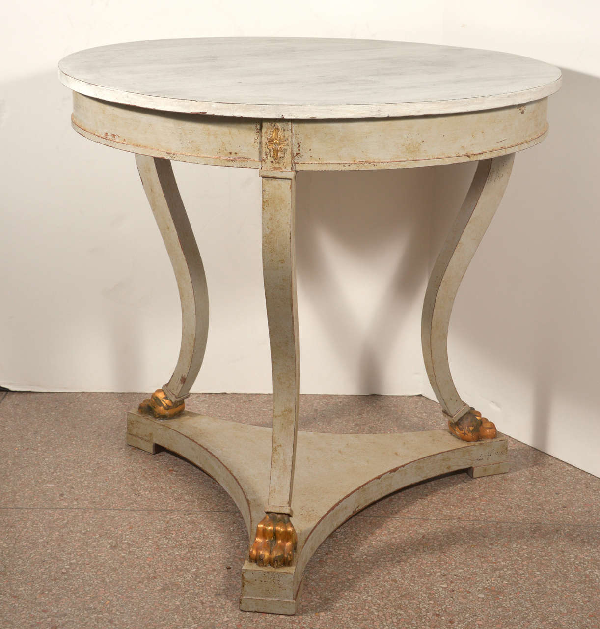 Center Table with Graceful Legs on a Footed Platform
Beautiful Gilt Details