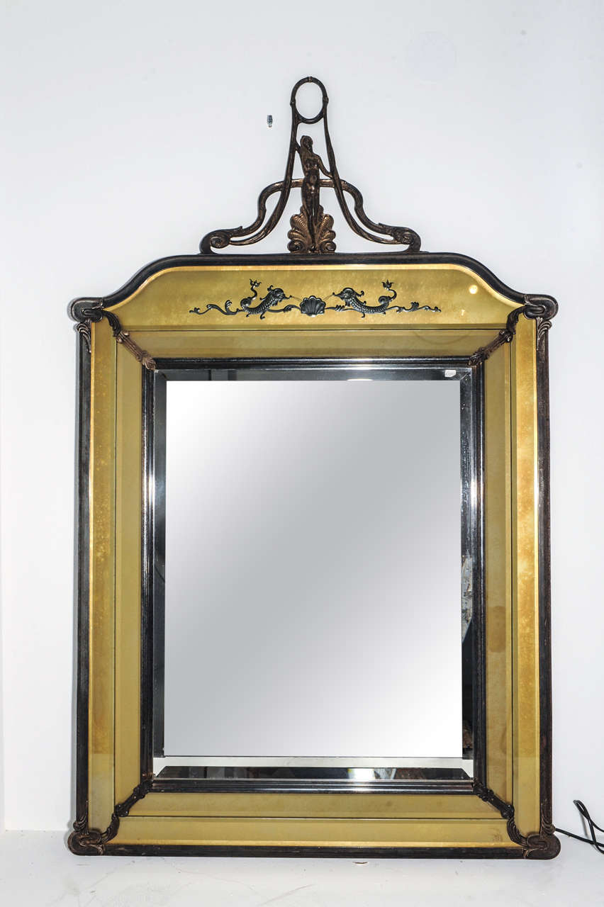 A silverplated double framed brass mirror in Art Nouveau style,  bronze/brass coloured cut glass panneling with edged dolphin ornaments. The color applied on the backside of the cut glass panels.