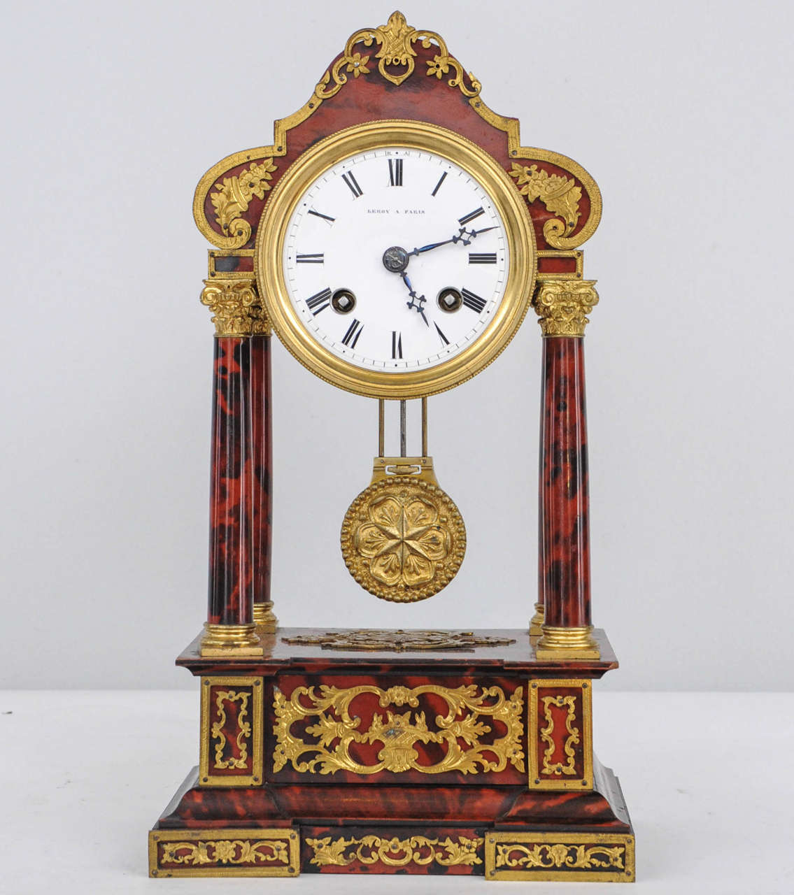 A very attractive small striking charming tortoiseshell four-pillar clock signed Leroy a Paris. Lovely bronze mounts together with matching dome, circa 1880.