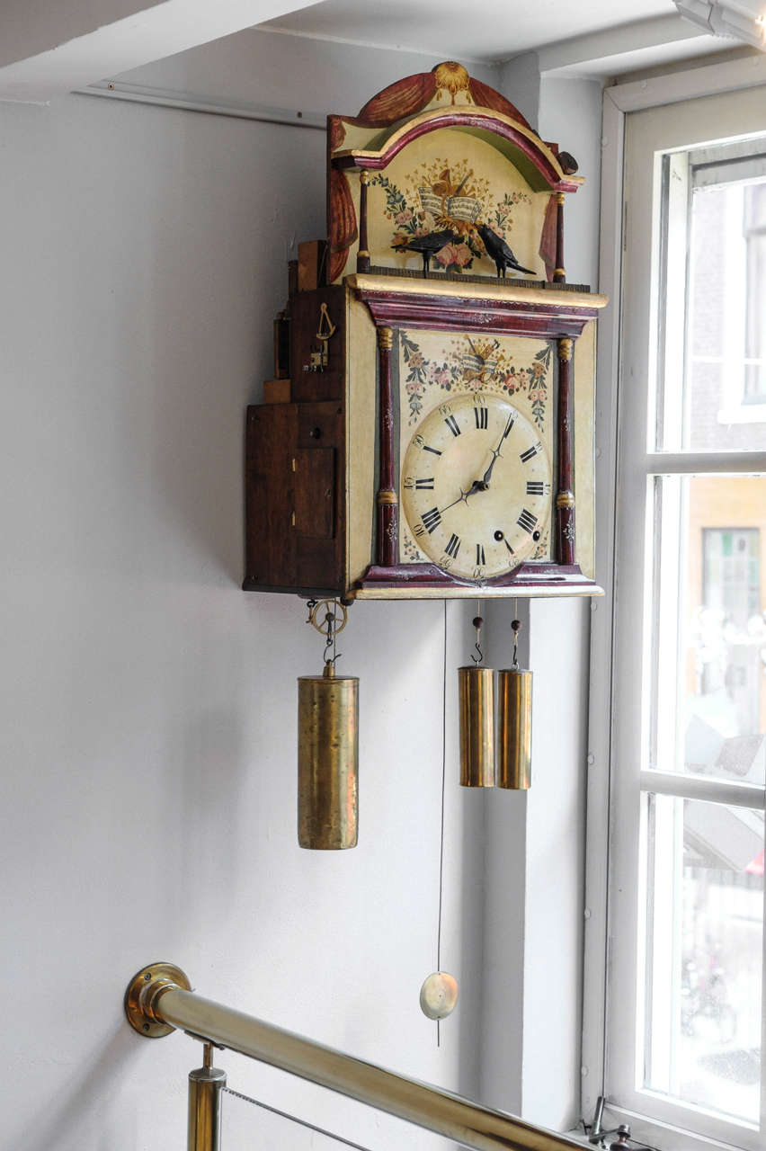 This so-called 'Flötenuhr' wallclock with is from Furtwange, Germany circa 1820. Behind the left case signed Joseph Schumager in Furtwangen. It indicates minutes and hours, with one week duration and strikes every full hour before playing twice in