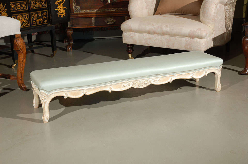 A Carved and Painted Hearth Bench, c. 1880, from the Mary Pickford/Pickfair Estate.  Newly upholstered in Suzanne Rheinstein*Hollyhock for Lee Jofa 