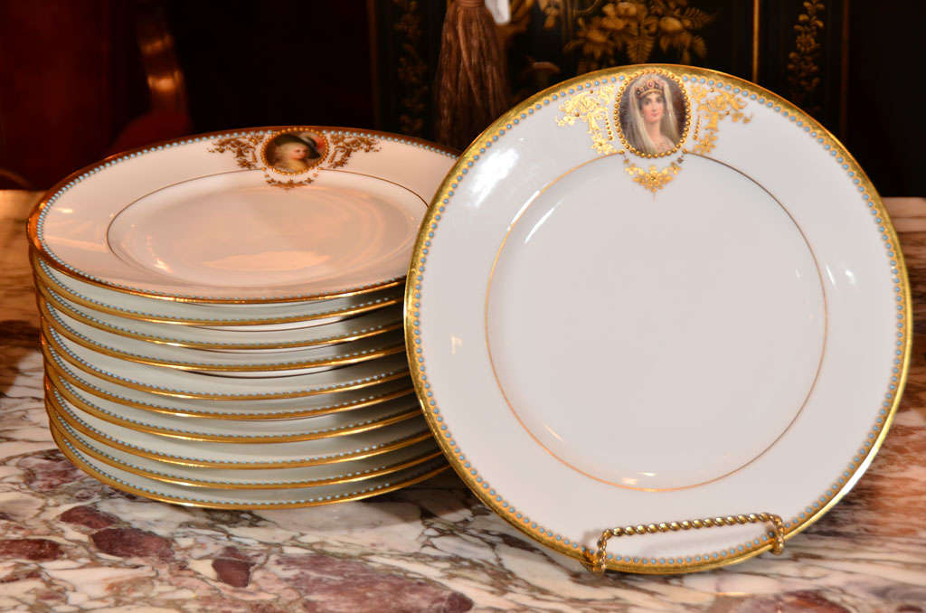 19th c set of 11 porcelain signed Wagner cabinet plates. Hand painted with raised gold detail