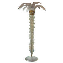 Floor lamp in palm tree .
