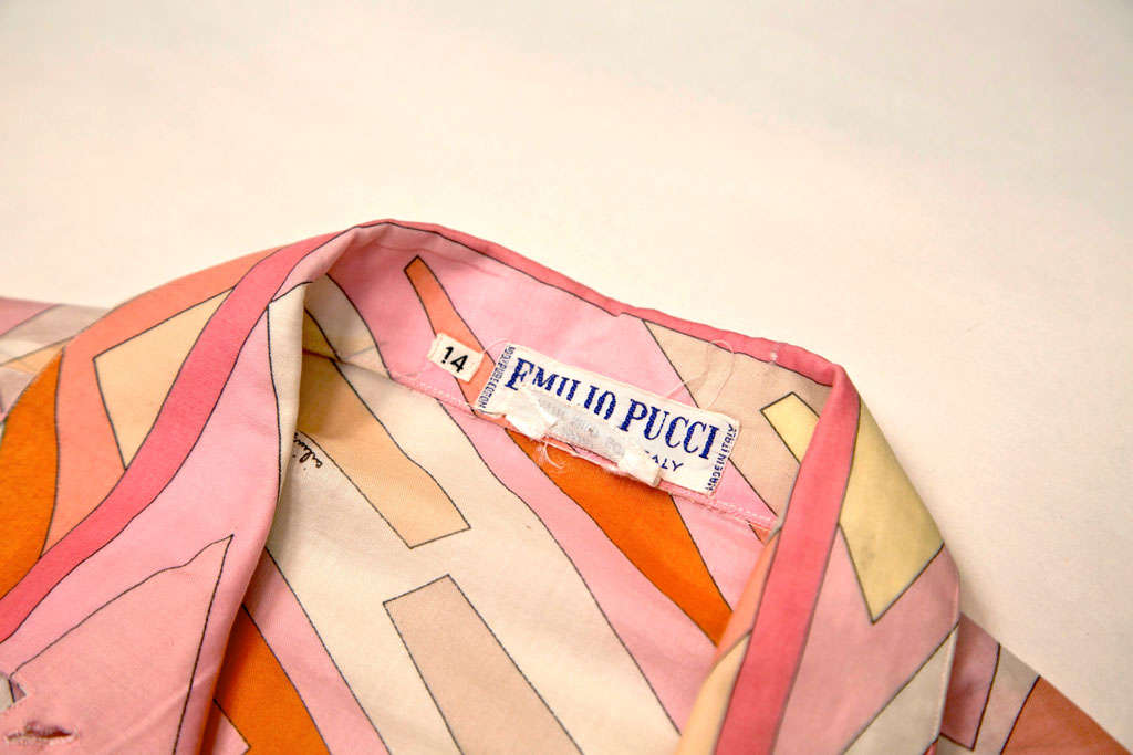 funkyfinders is pleased to share this epitome modernist cotton blouse and/or jacket from the house of pucci. it features adramatic geometric print with 'emilio' signatures meandering thru themotif. 1 of 2 quintessential vintage pucci pieces we've