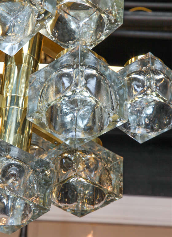 13 light chandelier designed by Gaetano Sciolari for Lightolier with glass shades in brass finish.