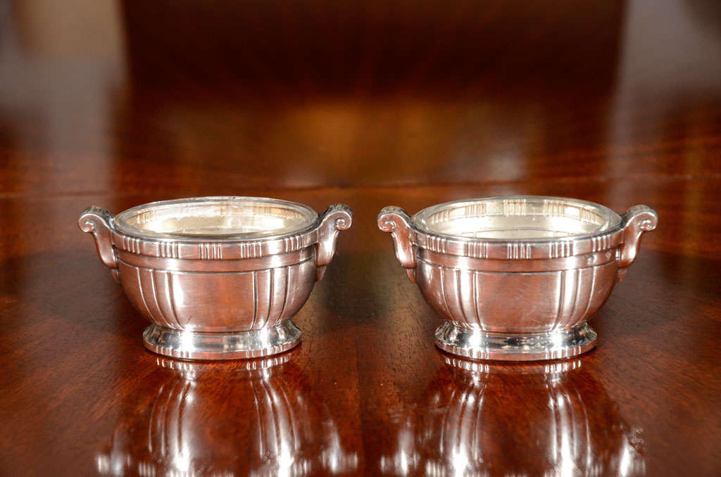 Pair of small silver salt cellars with glass inserts, marked with the head of Minerva (indicating silver of at least 92.5) and other marks, by Sue et Mar, French, 1925