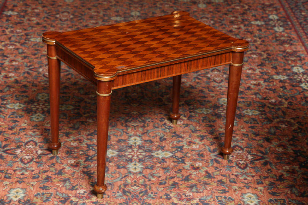 Jules Leleu (1883-1961).

Rosewood marquetry, with gilded bronze accents side table. 

Signed, numbered and dated 1953.

Measures: Height 21”, length 27”, depth 19”.