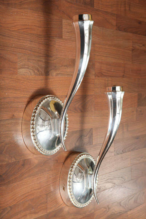 Pair of large single-arm sconces in the shape of an antelope Horn, in silvered bronze, circa 1940. (Two pairs available.) Height 19 in. Set of four sconces is available.