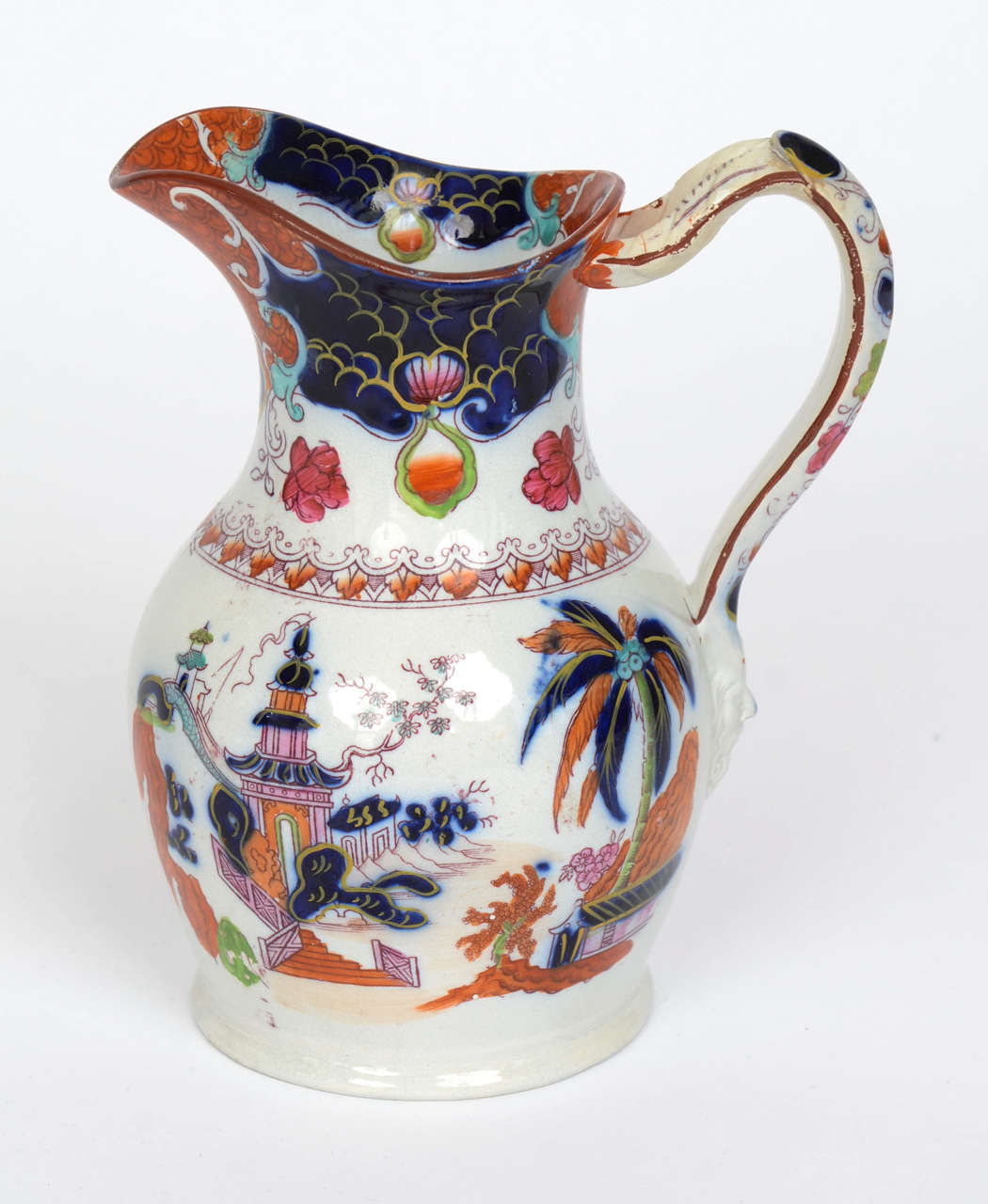 A very good example of an English pottery JUG or PITCHER

The jug has an ovoid form with an excellent loop handle, having a twin loop at the upper terminal, joining to form a single loop and terminating in a mans face ( mask head) at the lower