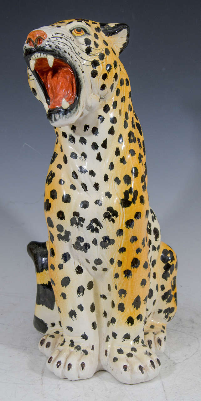 A vintage Italian ceramic hand-painted leopard sculpture with ferocious roar.

Good vintage condition with age appropriate wear.