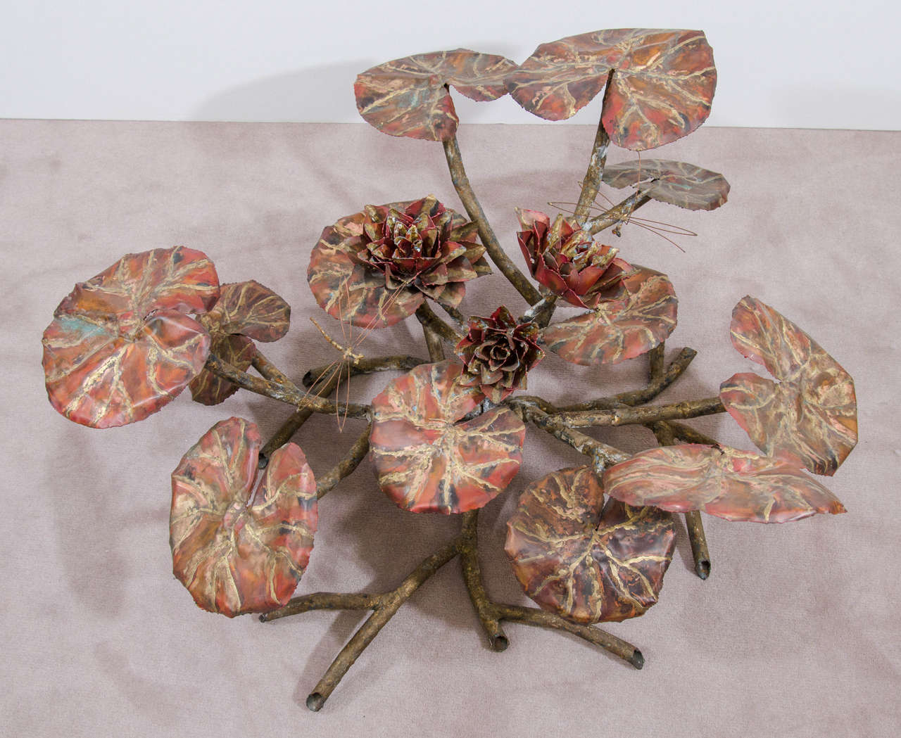 A vintage hand-wrought lily pad sculpture with dragonfly in the manner of Silas Seandel.

Good vintage condition with age appropriate patina.
