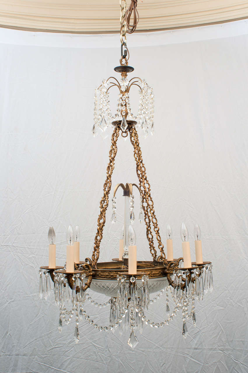 Handcrafted copy of an early 19th century fixture, eight lights. An excellent casting and exquisite crystal bowl and center obelisk. Appropriate chain, hanging hardware and ceiling cap included.
