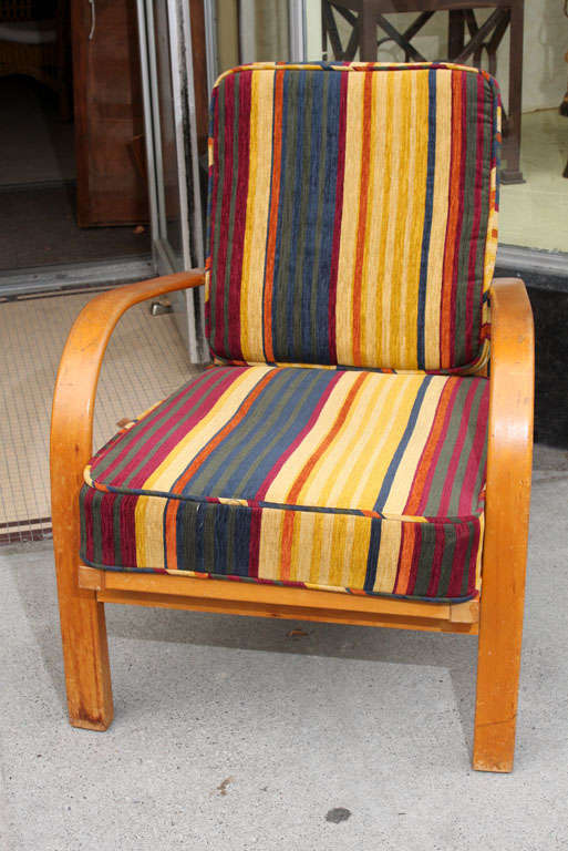 Casual armchair from Fritz Hansen in oak with leather back straps, cushions upholstered newly in Quadrille fabric.