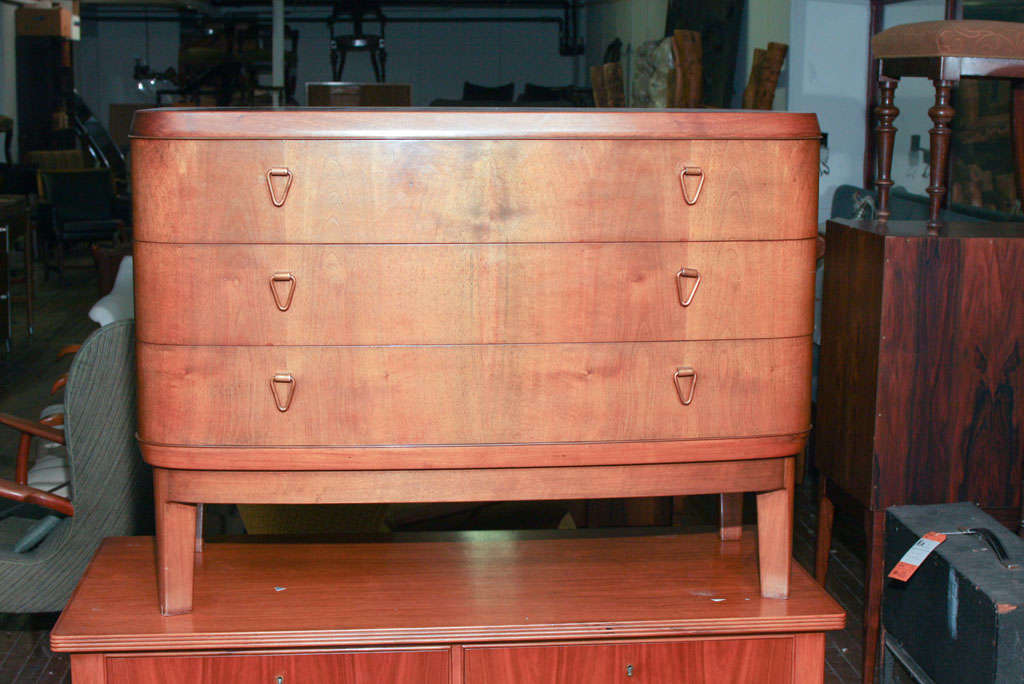 1950s three-drawer chest in walnut with copper handles.